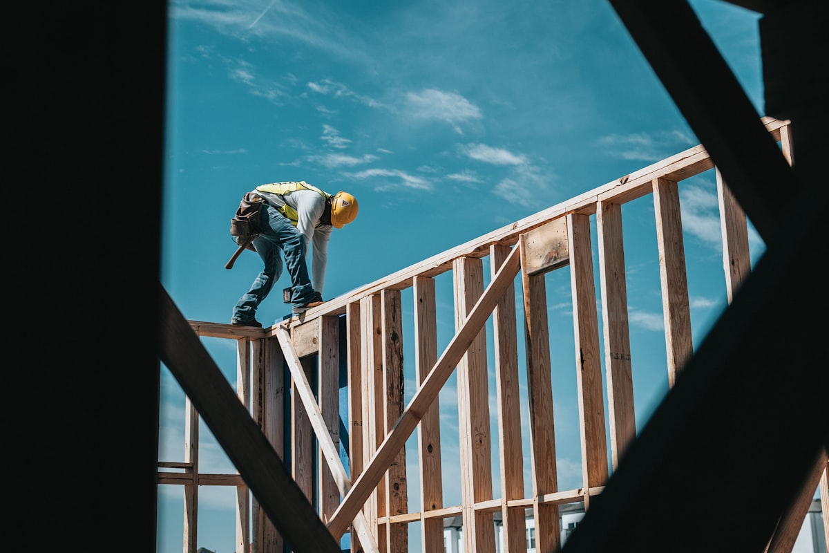Contractor framing a house under construction